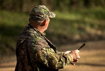 Man Using Turkey Call 