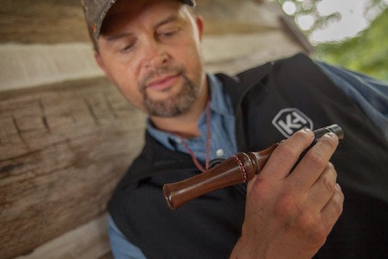 Man Holding Deer Call 