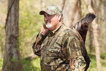 Man Holding Harvested Turkey