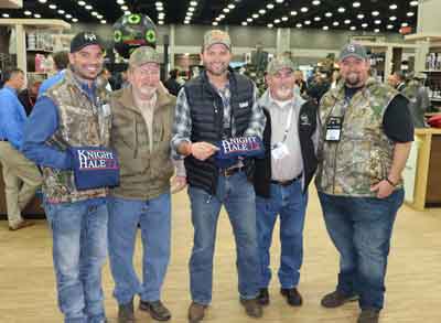 Founders of Knight and Hale Pose for a Picture with Michael Waddell 